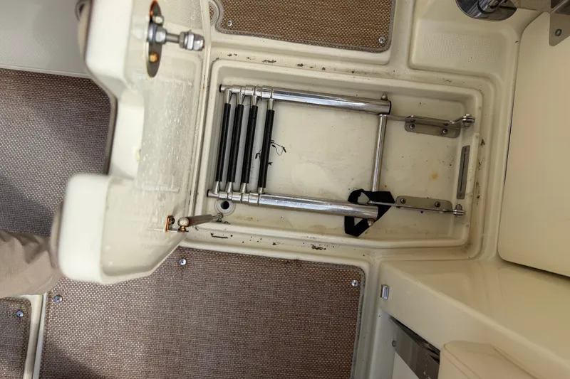 Slide: The Image of 2017 Chris-Craft Catalina 34 boat ladder compartment with stainless steel folding ladder. - 44