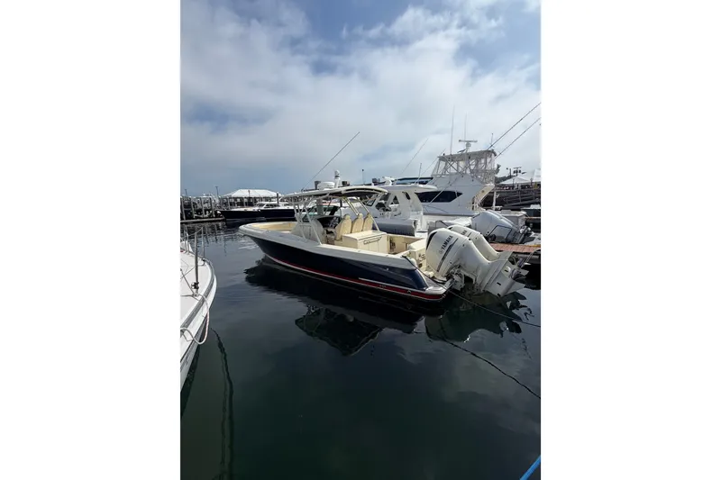 Slide: The Image of 2017 Chris-Craft Catalina 34 boat docked at marina under cloudy sky. - 49