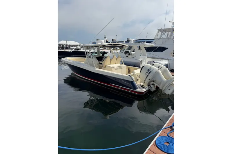 Slide: The Image of 2017 Chris-Craft Catalina 34 boat docked, featuring twin Yamaha engines, in a marina setting. - 48