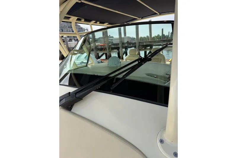 Slide: The Image of 2017 Chris-Craft Catalina 34 boat windshield with wiper, docked at marina. - 46