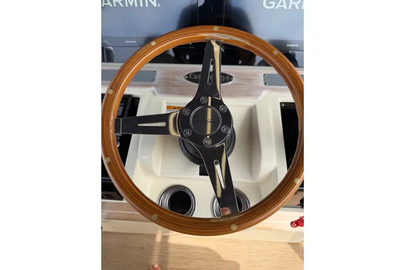 Slide: The Image of Steering wheel of 2017 Chris-Craft Catalina 34 boat with Garmin displays. - 38