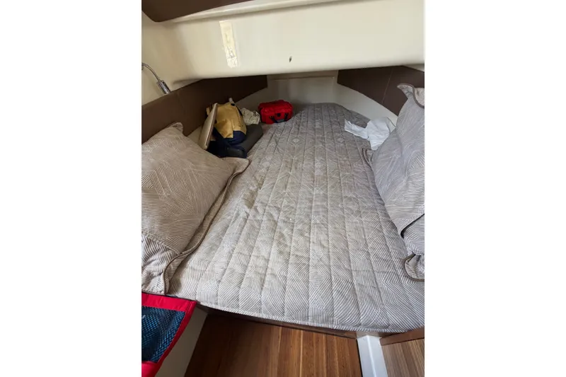 Slide: The Image of Cozy cabin interior of 2017 Chris-Craft Catalina 34 with bed and pillows. - 29