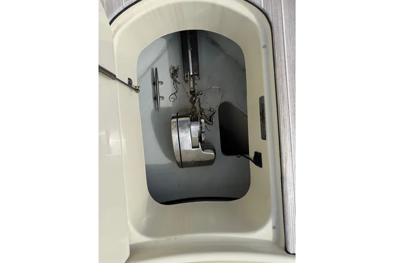 Slide: The Image of Anchor compartment of 2017 Chris-Craft Catalina 34 boat, featuring stainless steel anchor. - 31