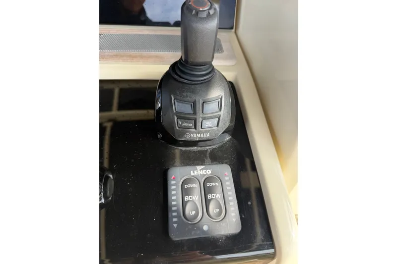 Slide: The Image of Control panel of a 2017 Chris-Craft Catalina 34 with Yamaha joystick and Lenco trim tabs. - 37