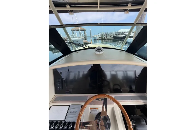 Slide: The Image of 2017 Chris-Craft Catalina 34 helm with Garmin navigation, docked at marina. - 43