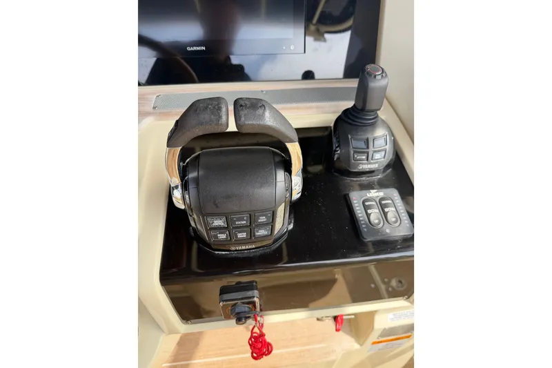 Slide: The Image of Control panel of 2017 Chris-Craft Catalina 34 boat with Yamaha throttle and joystick. - 36
