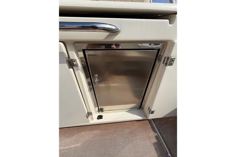 Slide: The Image of Stainless steel cabinet door on 2017 Chris-Craft Catalina 34 boat interior. - 17