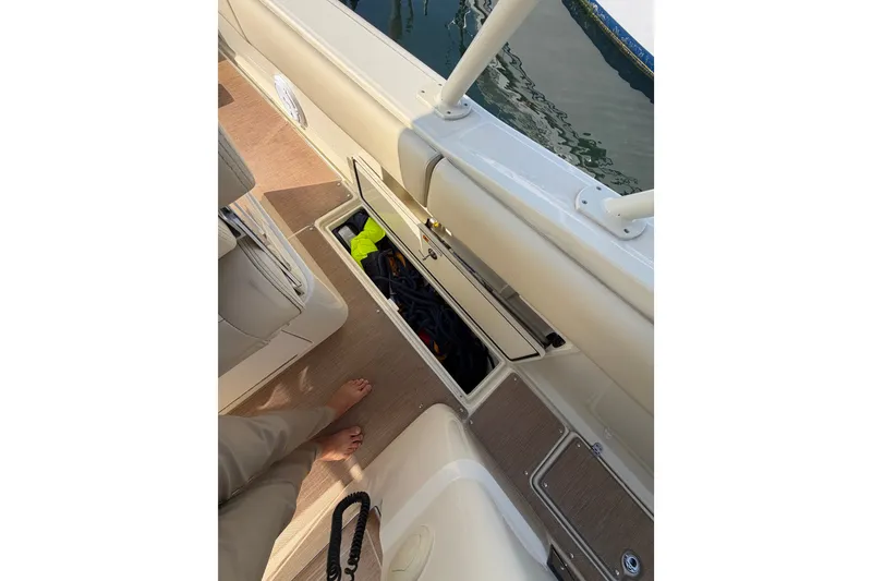Slide: The Image of 2017 Chris-Craft Catalina 34 boat interior with open storage compartment. - 21