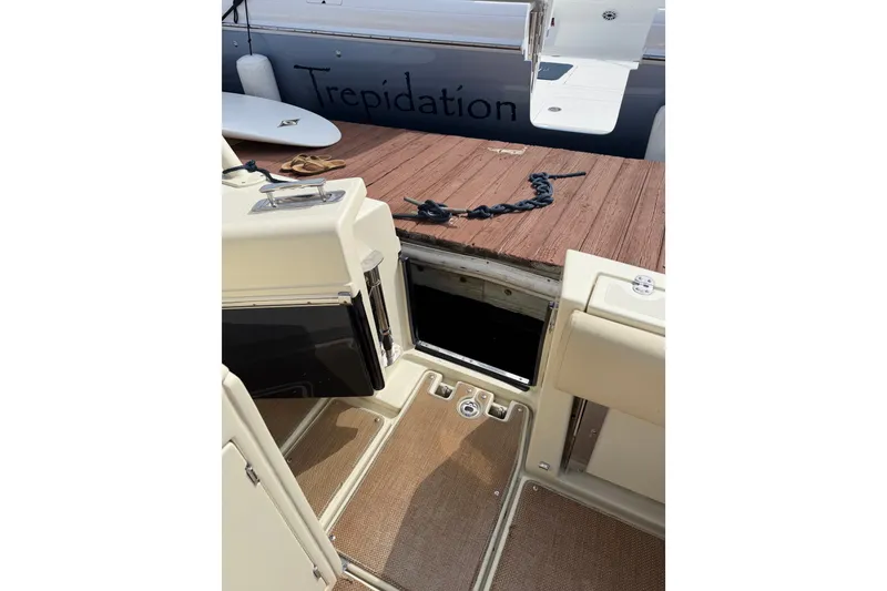 Slide: The Image of 2017 Chris-Craft Catalina 34 boat deck with open hatch and accessories. - 45