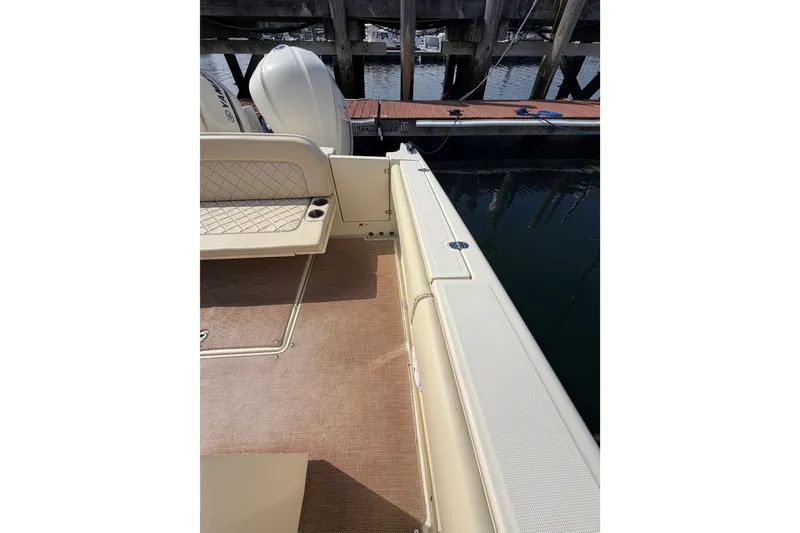 Slide: The Image of 2017 Chris-Craft Catalina 34 boat interior with seating and dock view. - 20
