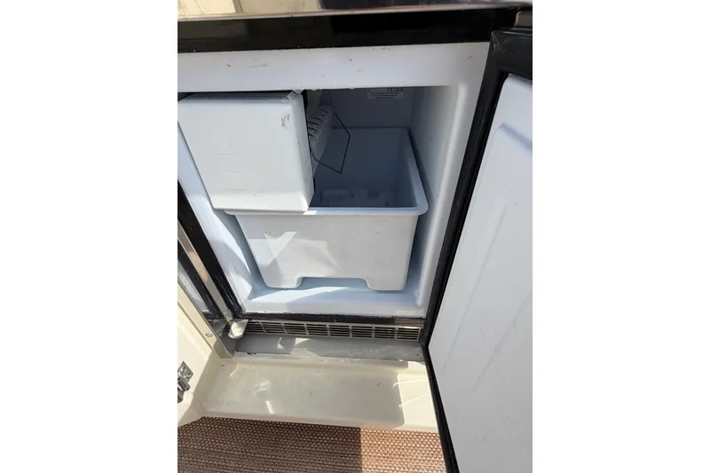 Slide: The Image of Open refrigerator compartment on 2017 Chris-Craft Catalina 34 boat. - 14