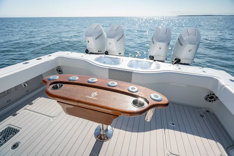 Slide: The Image of 2024 Freeman 43 boat with quad Mercury engines on open sea. - 22