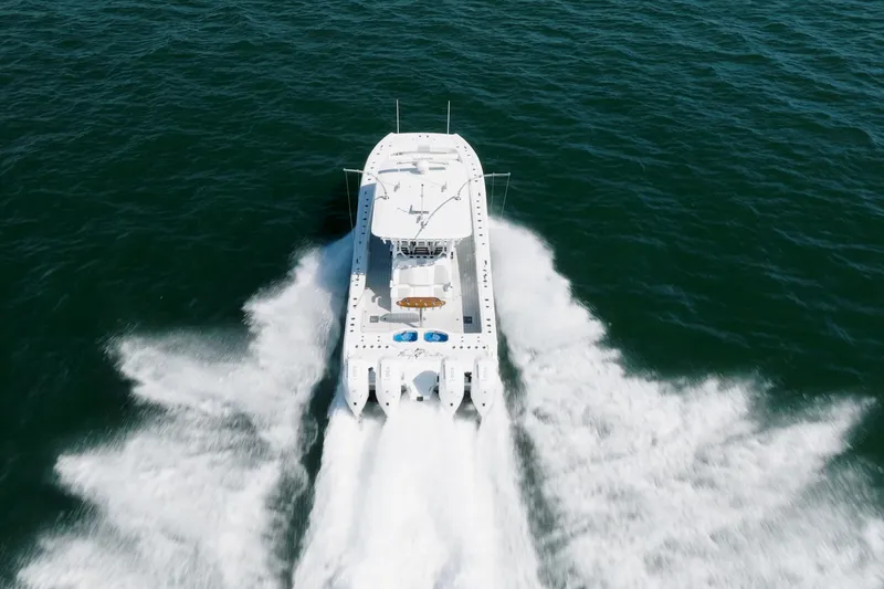 Slide: The Image of Aerial view of 2024 Freeman 43 boat cruising swiftly on open water. - 37