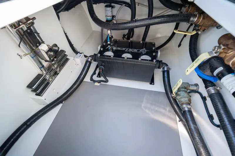Slide: The Image of Engine compartment of 2024 Freeman 43 boat, showcasing hoses and mechanical components. - 26