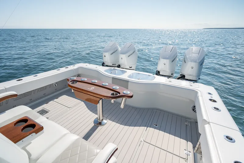 Slide: The Image of 2024 Freeman 43 boat with four Mercury engines on open sea. - 21