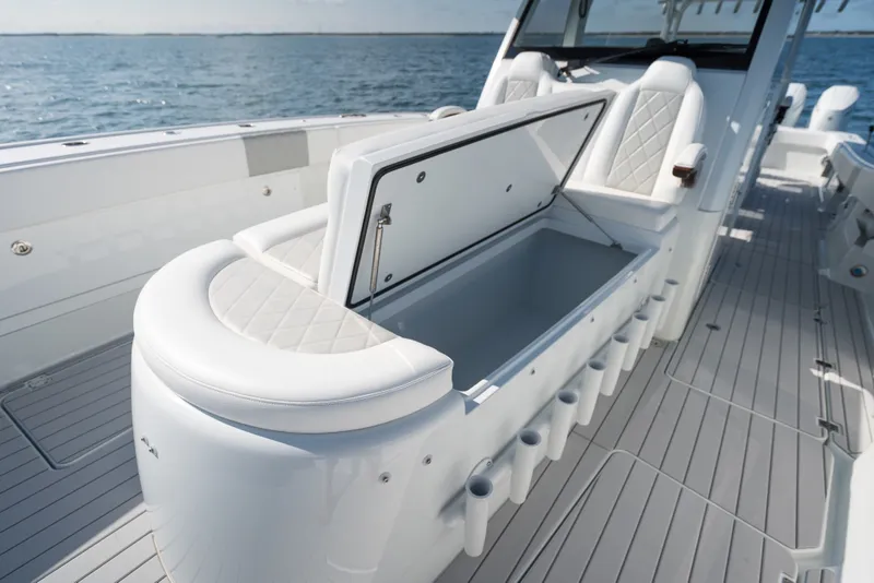 Slide: The Image of 2024 Freeman 43 boat interior with open storage compartment and luxurious seating. - 16