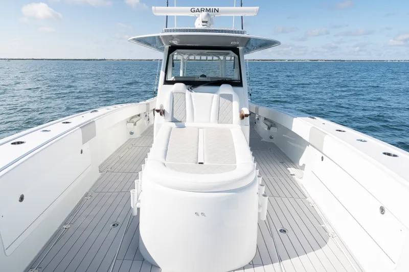 Slide: The Image of 2024 Freeman 43 boat with sleek white deck and Garmin equipment on open water. - 13