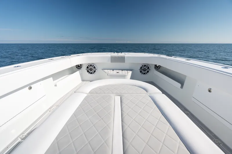 Slide: The Image of 2024 Freeman 43 boat interior with luxurious seating and ocean view. - 14