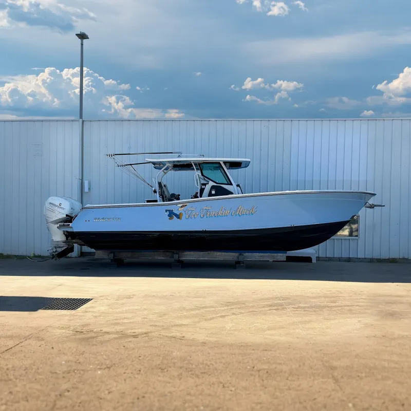 The Image of 2021 Blackfin 332 CC boat on display, featuring sleek design and powerful engines. - 0