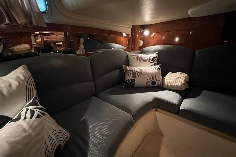 Slide: The Image of Luxurious interior of 2006 Four Winns 348 Vista yacht with cozy seating and decorative pillows. - 9