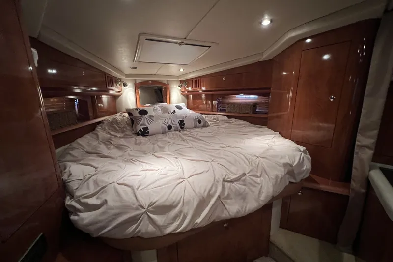 Slide: The Image of Luxurious cabin interior of 2006 Four Winns 348 Vista yacht with cozy bedding. - 31