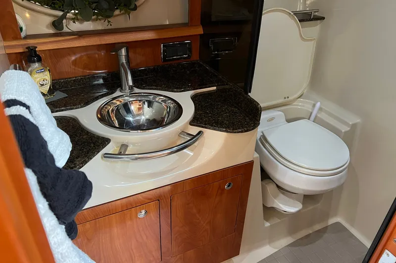Slide: The Image of Luxurious 2006 Four Winns 348 Vista yacht bathroom with modern sink and toilet. - 8