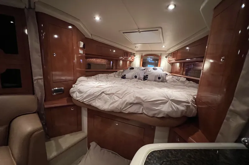 Slide: The Image of Luxurious cabin interior of 2006 Four Winns 348 Vista yacht with cozy bedding. - 3