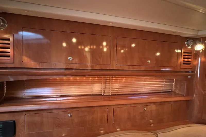 Slide: The Image of Interior of 2006 Four Winns 348 Vista yacht with wooden cabinetry and blinds. - 28