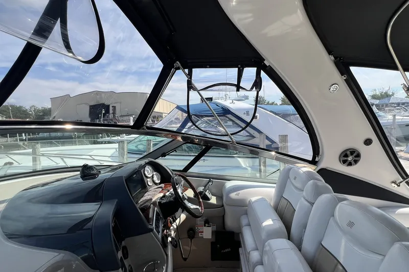 Slide: The Image of Interior view of 2006 Four Winns 348 Vista boat cockpit with steering wheel and seating. - 37