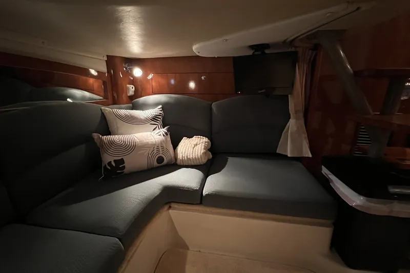 Slide: The Image of Interior of 2006 Four Winns 348 Vista yacht with cozy seating and decorative pillows. - 8