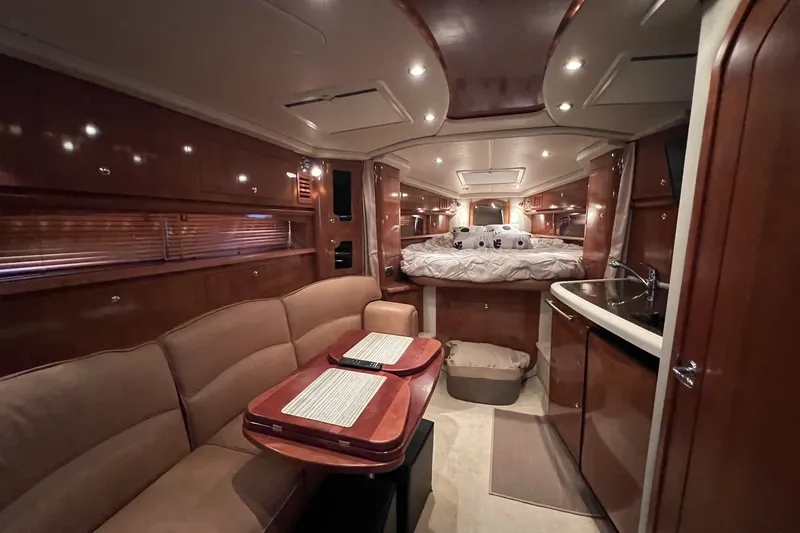 Slide: The Image of Luxurious interior of 2006 Four Winns 348 Vista yacht with cozy seating and elegant wood finishes. - 7