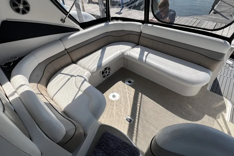 Slide: The Image of 2006 Four Winns 348 Vista boat interior with beige seating and carpeted floor. - 39