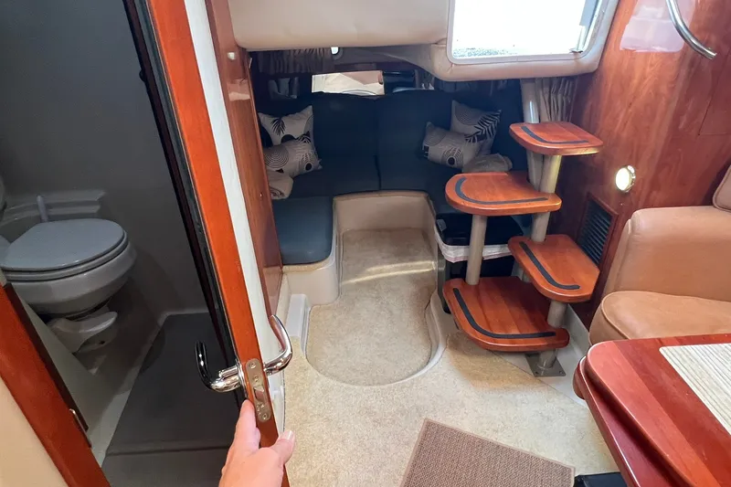 Slide: The Image of Interior of 2006 Four Winns 348 Vista yacht with seating and compact bathroom. - 6