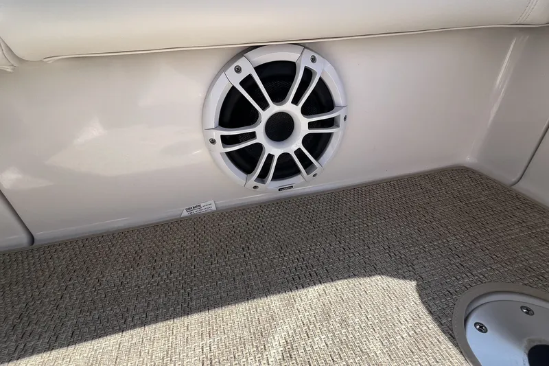 Slide: The Image of Speaker installed on 2006 Four Winns 348 Vista boat interior with carpeted flooring. - 41