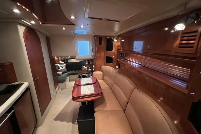 Slide: The Image of Luxurious interior of 2006 Four Winns 348 Vista yacht with elegant wood finishes. - 30