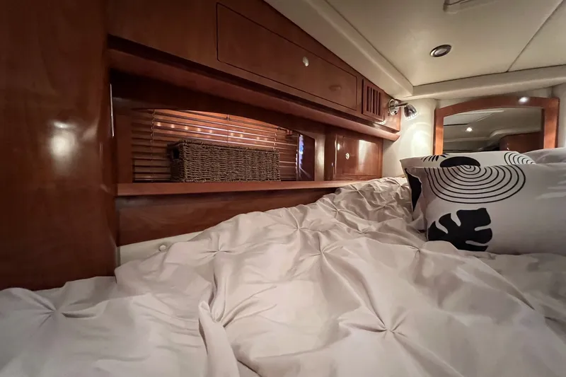 Slide: The Image of Luxurious cabin interior of 2006 Four Winns 348 Vista yacht with plush bedding. - 4