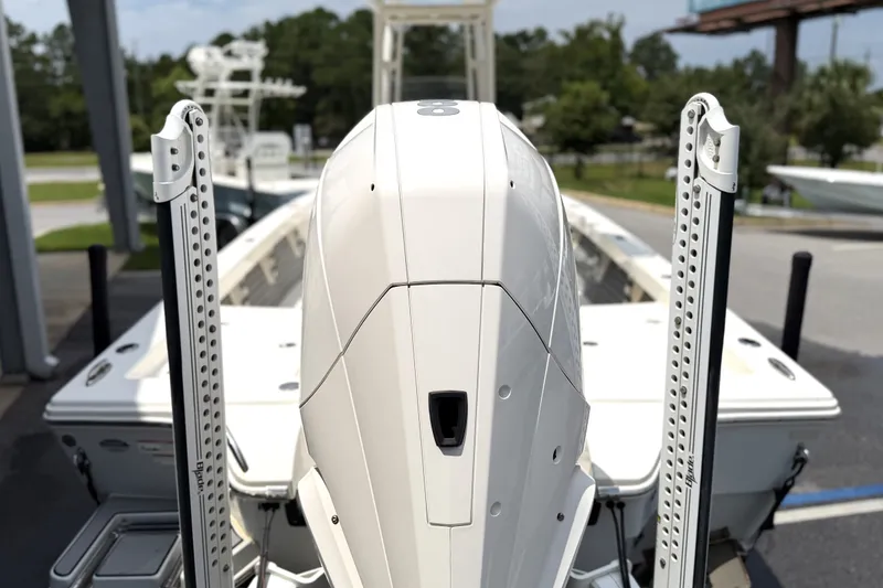 Slide: The Image of 2022 Pathfinder 2600 HPS boat with dual power poles and outboard motor. - 2