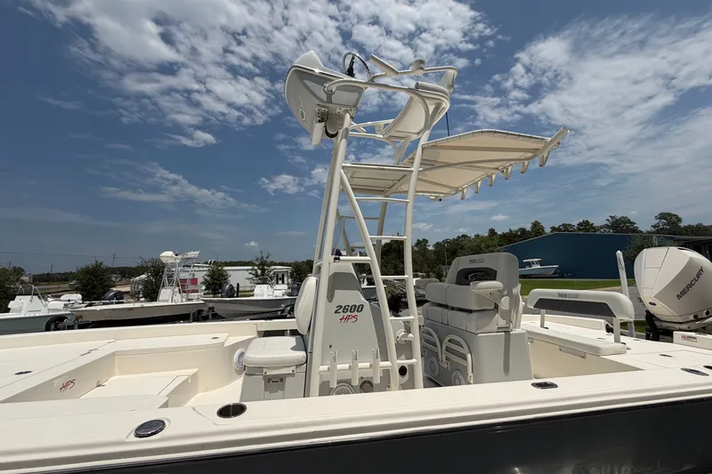 Slide: The Image of 2022 Pathfinder 2600 HPS boat with T-top, under a partly cloudy sky. - 6