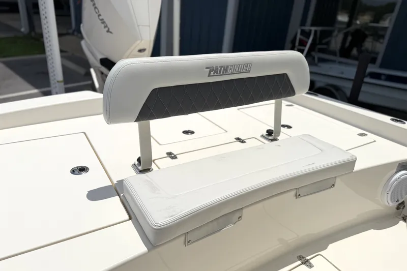 Slide: The Image of 2022 Pathfinder 2600 HPS boat seat with logo, featuring white and gray upholstery. - 9