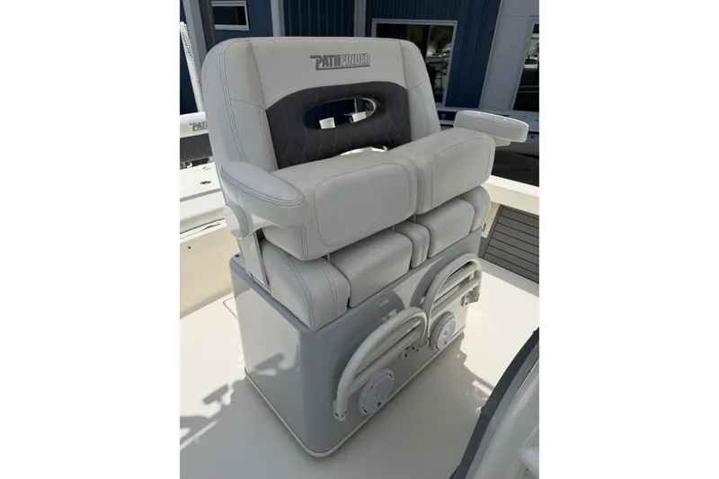 Slide: The Image of 2022 Pathfinder 2600 HPS boat seat with cushioned armrests and storage compartments. - 13