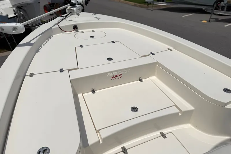 Slide: The Image of 2022 Pathfinder 2600 HPS boat deck with storage compartments and trolling motor. - 18