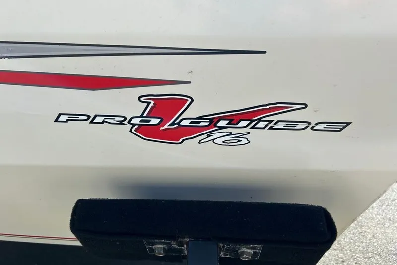 Slide: The Image of 2020 Tracker Pro Guide V-16 WT boat logo with red and black design. - 13