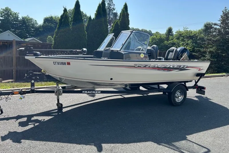 The Image of 2020 Tracker Pro Guide V-16 WT boat on trailer, parked outdoors. - 0