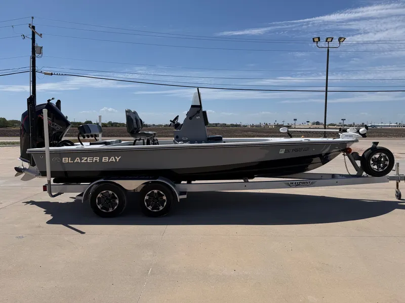 Slide: The Image of A 2023 Blazer Bay 2220 GTS boat on a trailer, ready for use. - 7