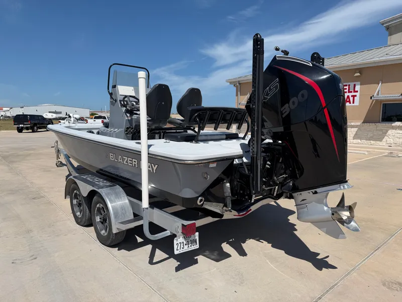 Slide: The Image of The image shows a 2023 Blazer Bay 2220 GTS boat on a trailer. - 10
