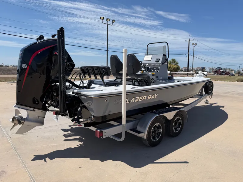Slide: The Image of A gray boat on a trailer with a powerful outboard motor and two seats. - 8