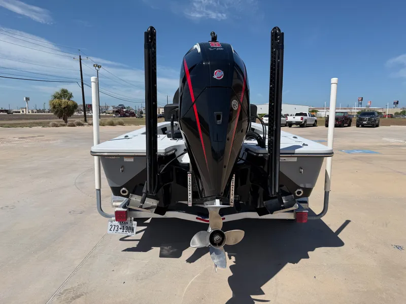 Slide: The Image of The image shows the rear of a 2023 Blazer Bay 2220 GTS boat with an outboard motor. - 9