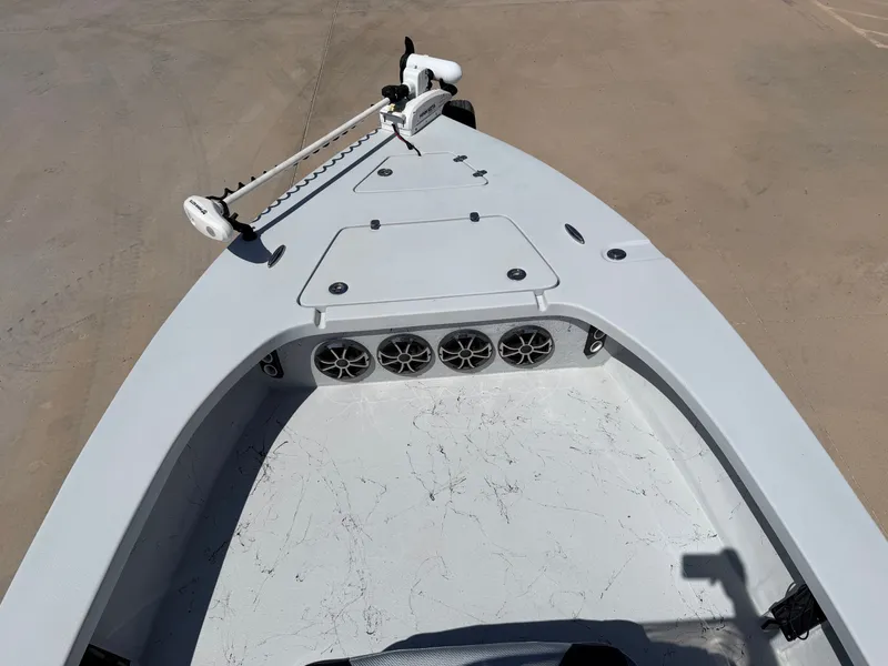 Slide: The Image of The image shows the bow of a Blazer Bay 2220 GTS boat with speakers and a trolling motor. - 12