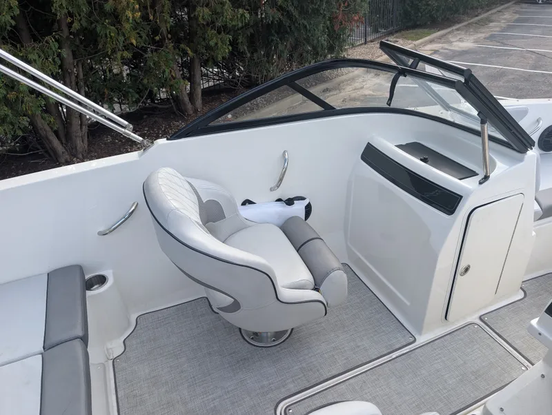Slide: The Image of The image shows the cockpit of a 2023 Bayliner VR4 Bowrider with a swivel captain's chair. - 10