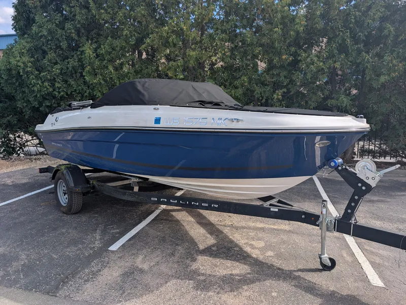 Slide: The Image of A 2023 Bayliner VR4 Bowrider on a trailer, featuring a blue and white color scheme. - 7